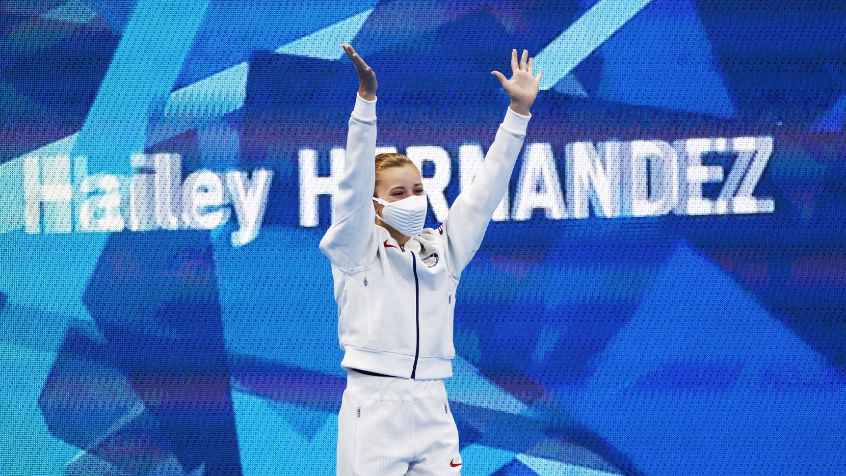 USA’s Hailey Hernandez waves as she is introduced before the start of the women’s 3 meter...