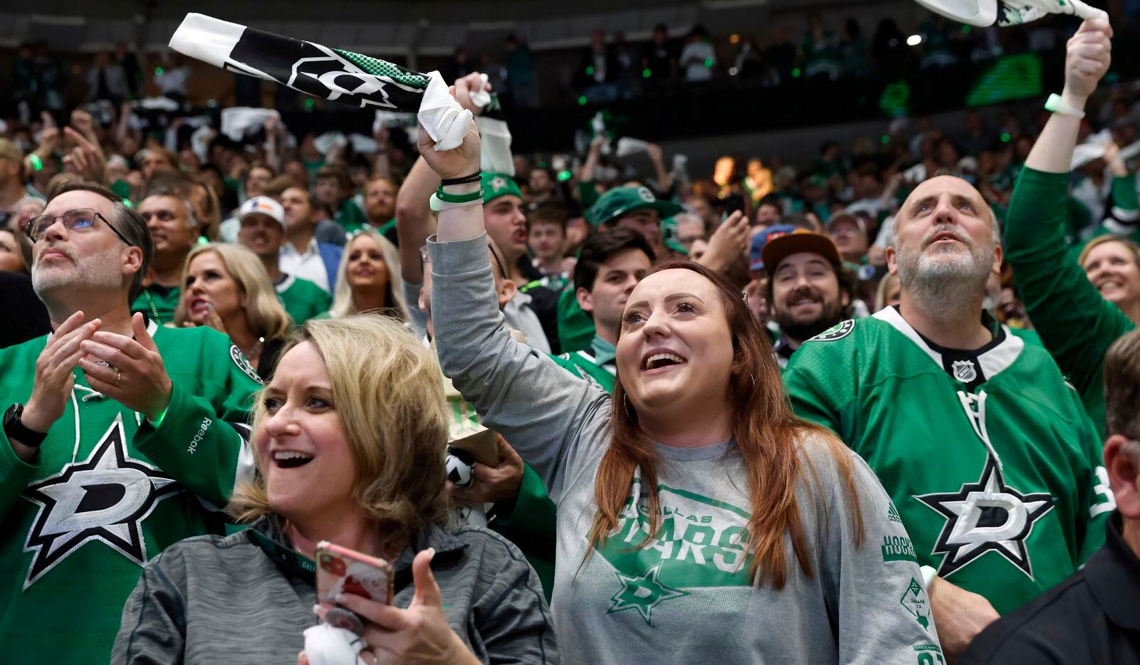 Dallas Stars fans cheer after a first period goal against the Calgary Flames in Game 6 of a...