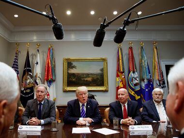 President Donald Trump meets with members of the House Ways and Means committee in the...