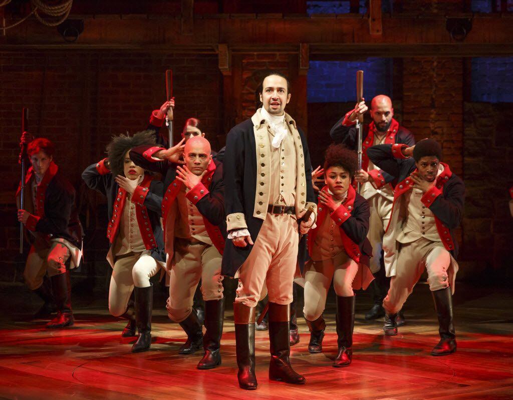 This image released by The Public Theater shows Lin-Manuel Miranda with the cast during a...