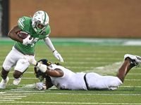 North Texas wide receiver Roderic Burns (24) breaks free from Southern Miss defensive back...