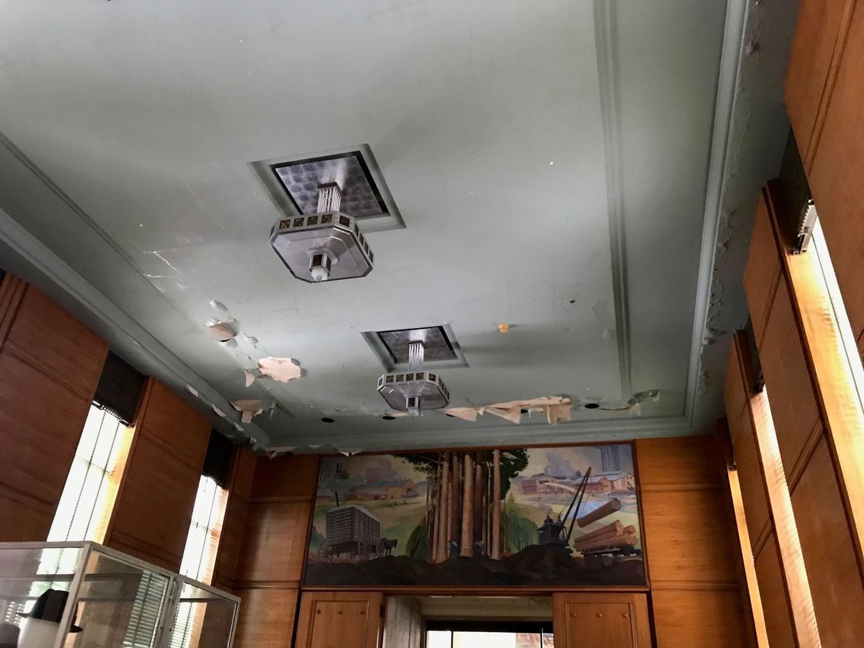 A photo shows damage to the ceiling of the East Texas room in the Hall of State in Dallas on...