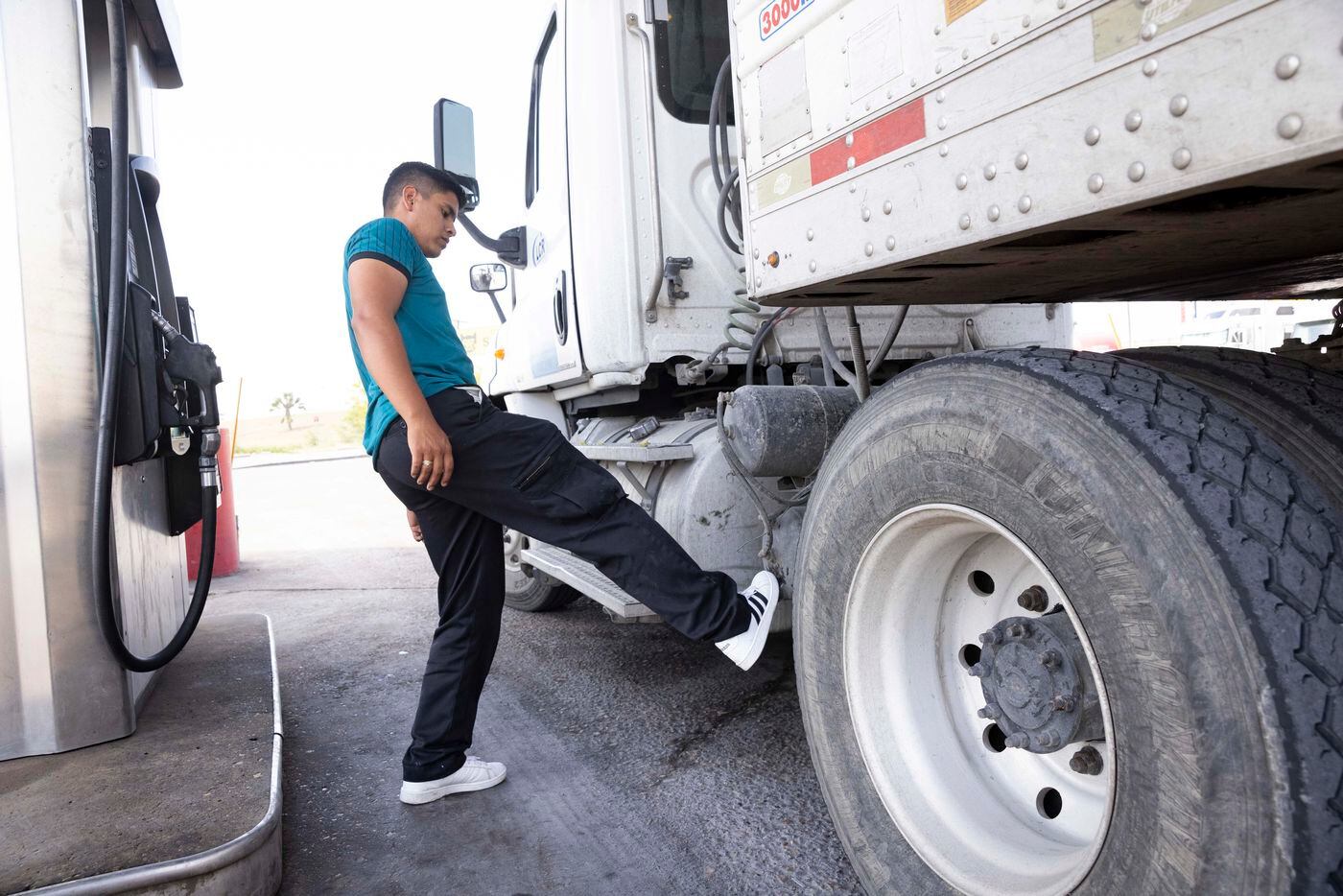 Truck driver Ulises Salas stops to refuel his truck near the Pharr–Reynosa International...