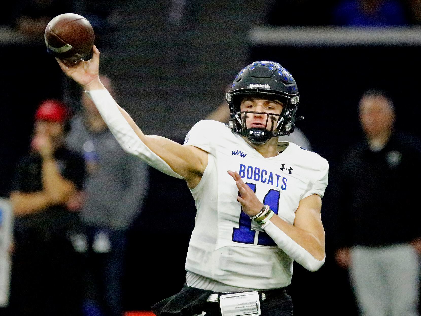 Byron Nelson High School quarterback Jake Wilson (11) throws a pass during the first half as...