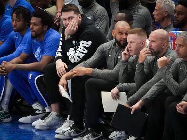 Dallas Mavericks guard Luka Doncic watches from the bench during the first quarter in Game 1...