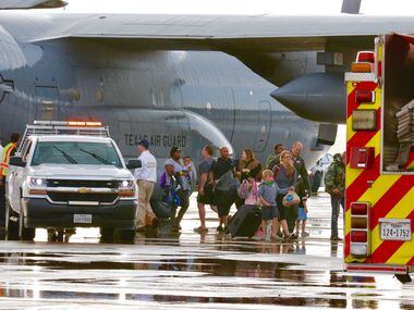 Evacuees from Hurricane Harvey arrived Dallas Love Field on a military aircraft on Monday,...