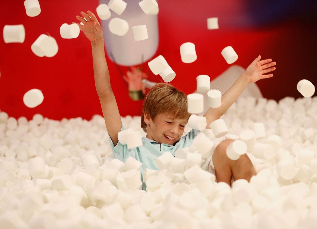 William LeBlanc, 9, plays in the marshmallow pit at Candytopia.
