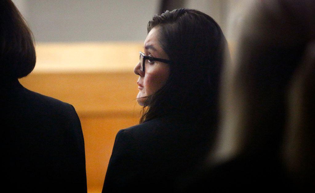 Defendant Brenda Delgado looks over her shoulder during her murder trial in the 363rd...
