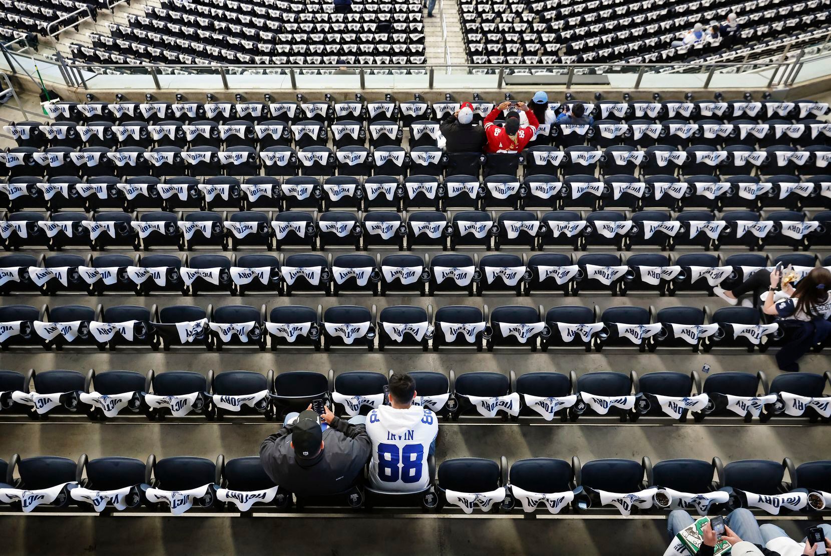 Dallas Cowboys fans trickle into the white towel-lined seating of AT&T Stadium for the NFL...
