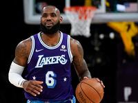 Los Angeles Lakers forward LeBron James (6) controls the ball during an NBA basketball game...