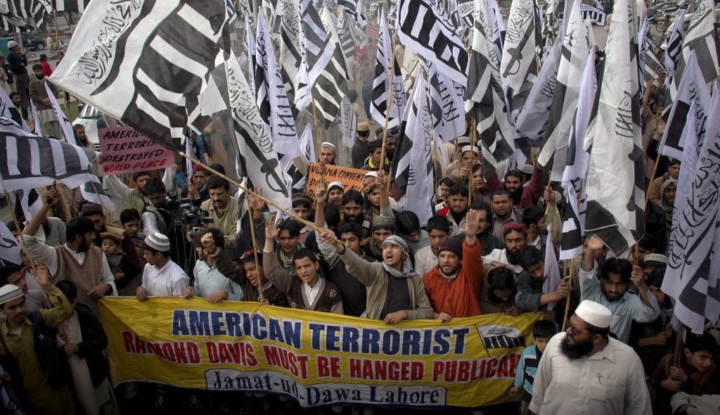 Demonstrators in Pakistan march in support of Hafiz Saeed, the leader of terrorist group...