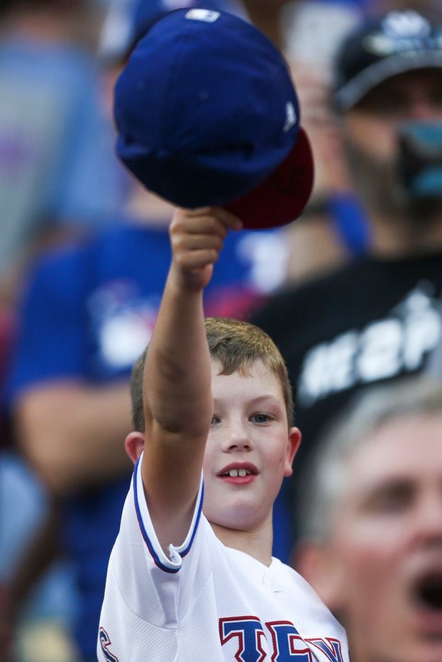 A young fan tip his hat off to AdriÃ¡n BeltrÃ© as he is introduced amongst the Globe Life...