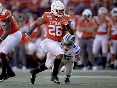 Texas running back Keaontay Ingram (26) runs for a touchdown against Kansas State during an NCAA college football game Saturday, Nov. 9, 2019, in Austin, Texas. (Nick Wagner/Austin American-Statesman via AP)