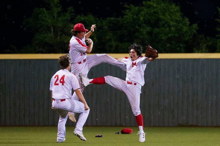 Flower Mound Marcus' Rock Duer (right) cheers with his teammates after making the winning...