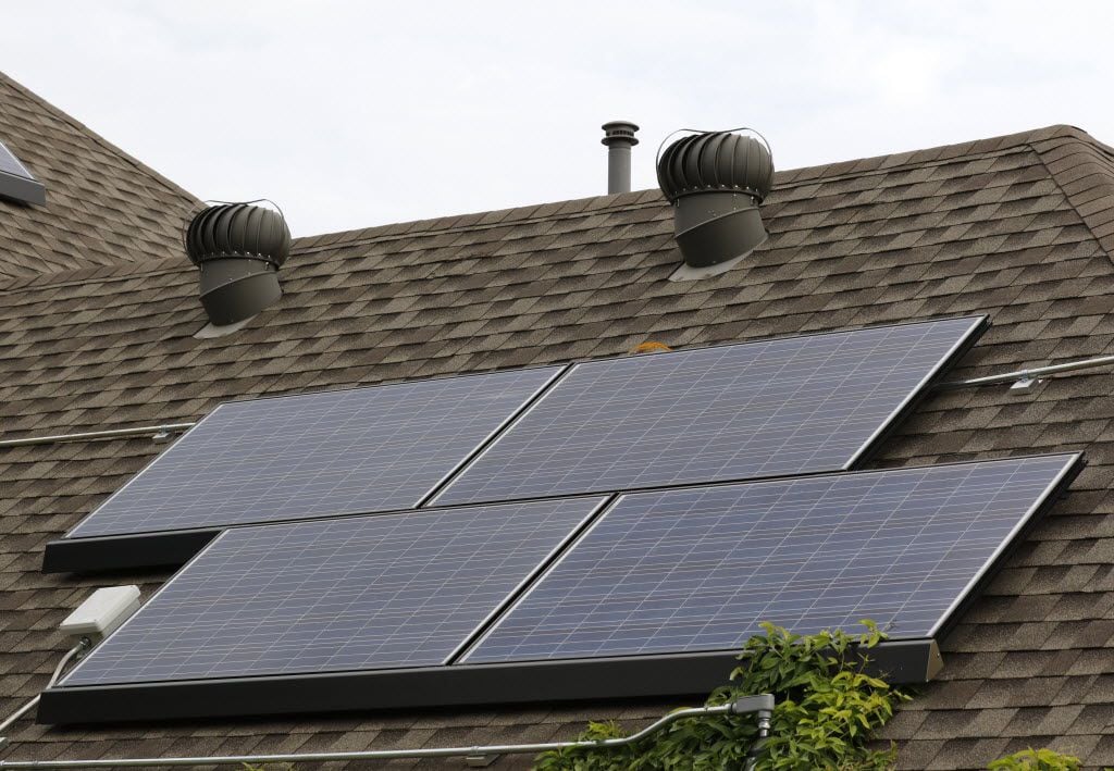 This 2019 file photo shows solar panels on a roof in Allen.