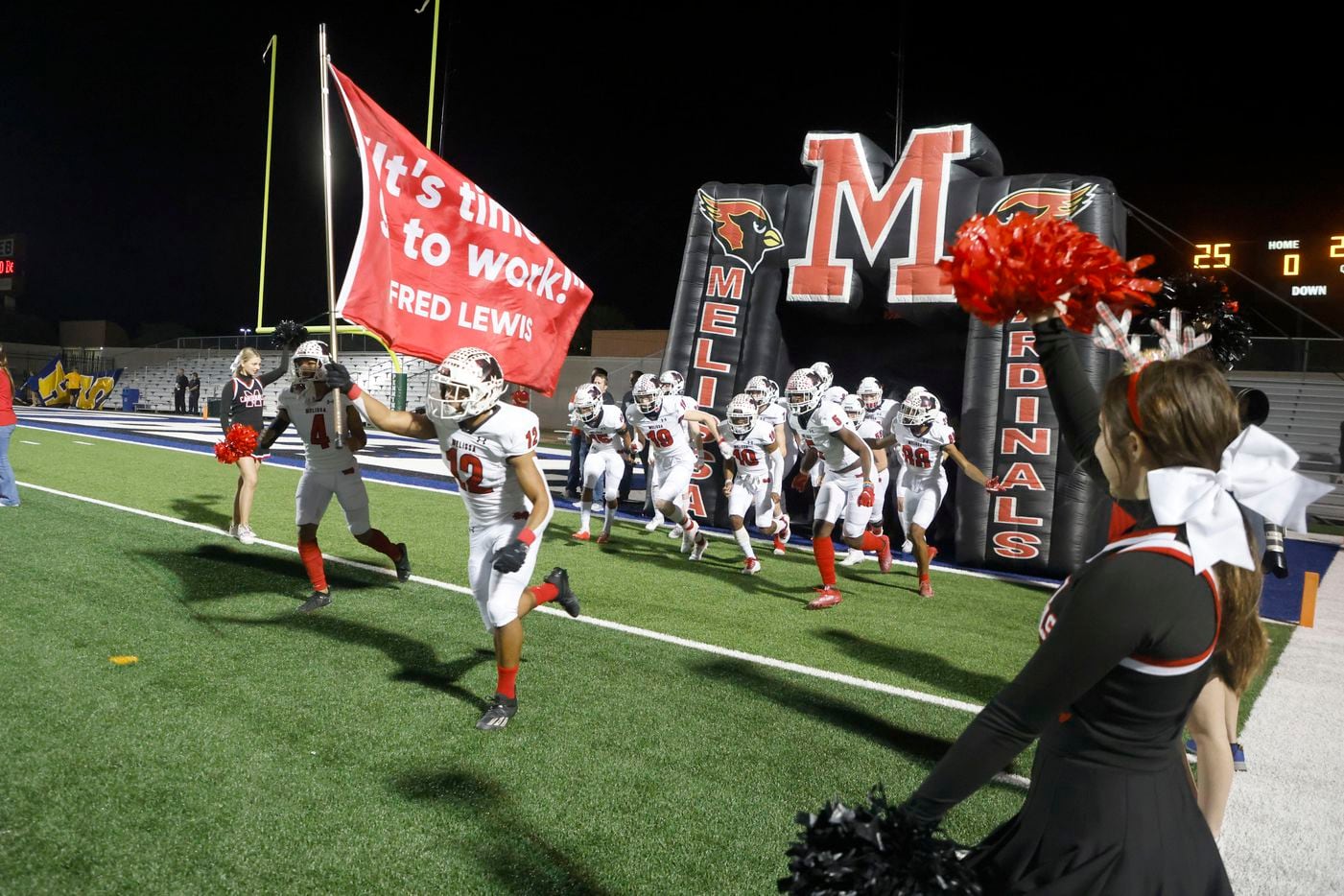 Melissa’s Ashton Mitchell-Johnson (12) leads the team onto the field as they played Stephenville during a Class 4A Division I Region II final high school football game in Bedford, Texas on Friday, Dec. 3, 2021. (Michael Ainsworth/Special Contributor)