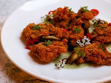 The fried chicken Provençal is among the small bites and shared plates available at...