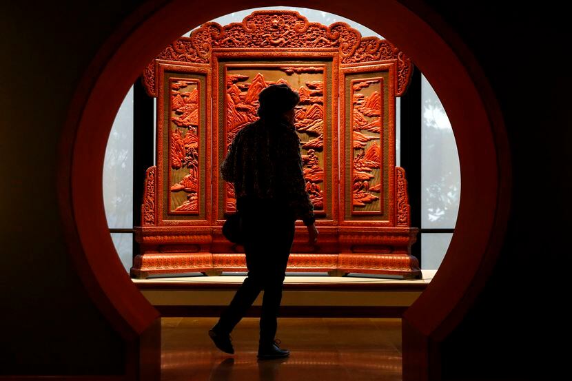 Florence Barnett walks past a lacquered screen at the Crow Museum of Asian Art in Dallas on...