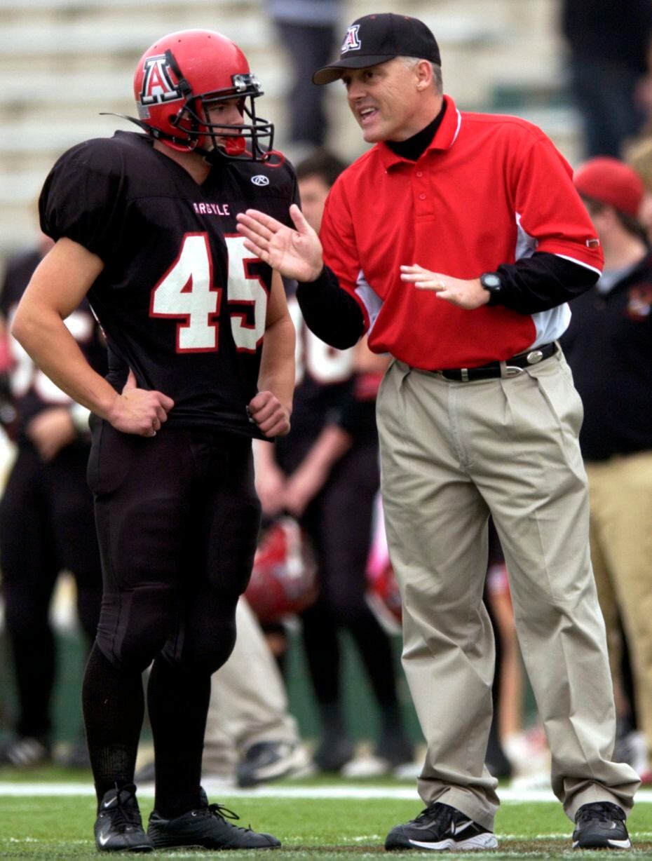FILE: Argyle High School head coach Todd Rodgers talks to Zac Anderson (45) during a...