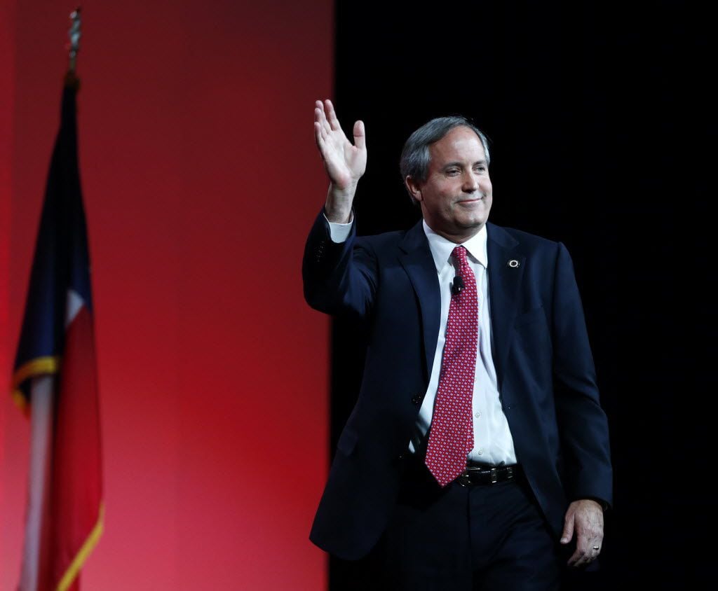 Texas Attorney General Ken Paxton waves to the crowd after speaking during the 2016 Texas Republican Convention at the Kay Bailey Hutchison Convention Center in Dallas, on Saturday, May 14, 2016.