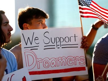 Jordin Chavez stands in the crowd with a sign during a support rally for DACA recipients at City Hall Plaza in Dallas on Wednesday, Sept. 6, 2017.