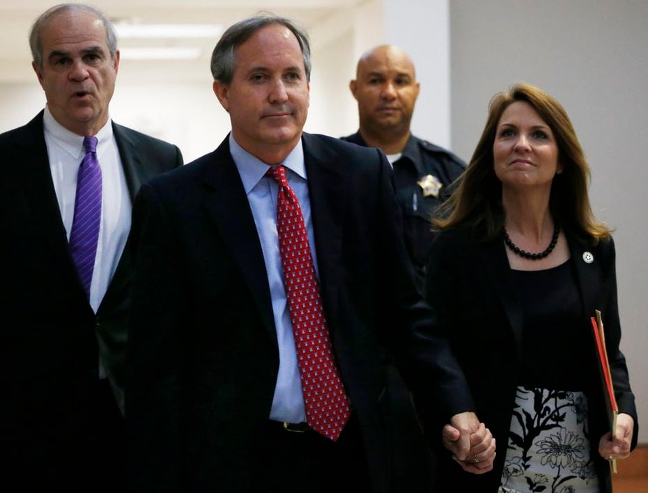  Texas Attorney General Ken Paxton and his wife, Angela, entered the Merrill Hartman...