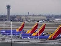 Four Southwest Airlines passenger jets sit at their gates at Chicago's Midway Airport as...