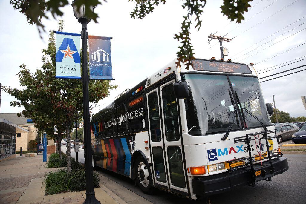The Metro ArlingtonXpress bus pulls out from College Park Center in Arlington, Texas on Nov....