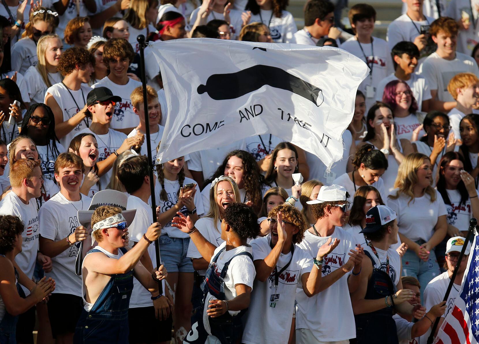 The Allen High School student section cheers their team during the first half as Allen High...