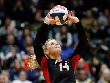 Colleyville Heritage High School setter Morgan Howard (14) makes a set during game three as...