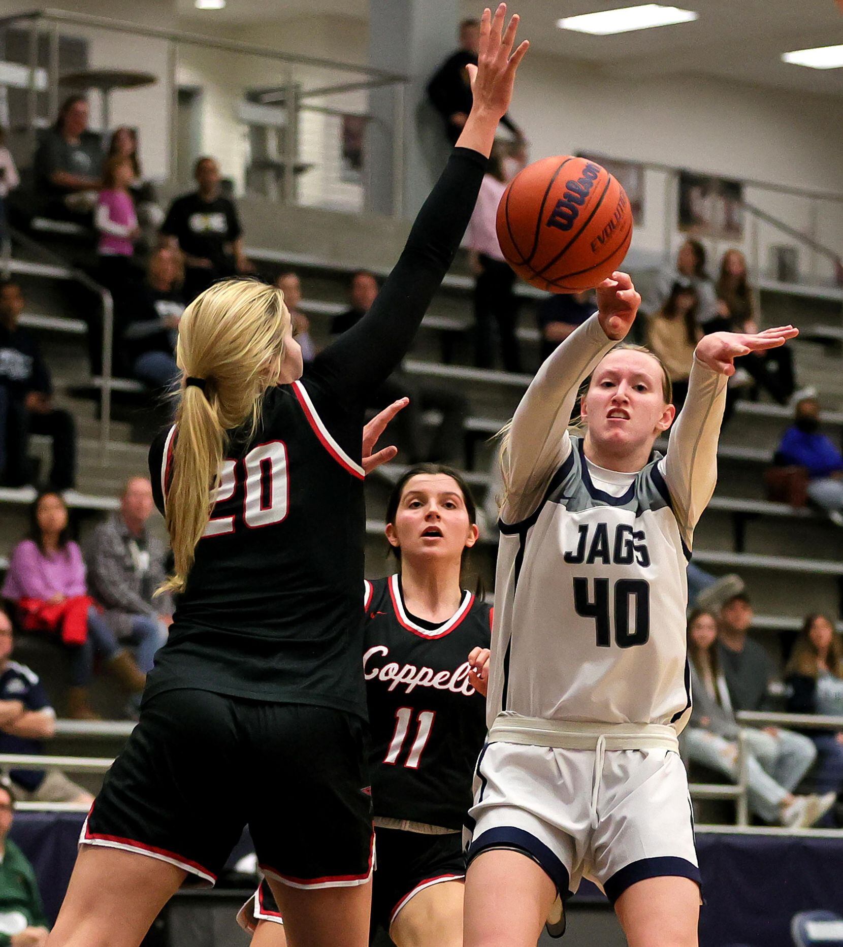 Flower Mound guard Madison Cox (40) tries to make a pass against Coppell guard Julianna...