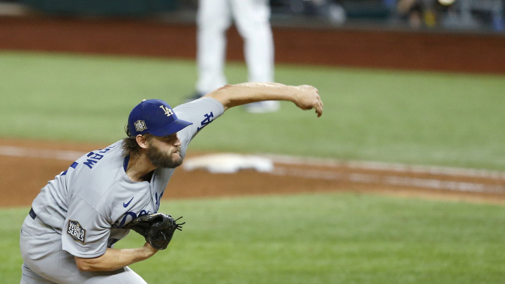 Los Angeles Dodgers starting pitcher Clayton Kershaw (22) pitches in a game against the Tampa Bay Rays during the sixth inning of game five of the World Series at Globe Life Field on Sunday, October 25, 2020 in Arlington, Texas.