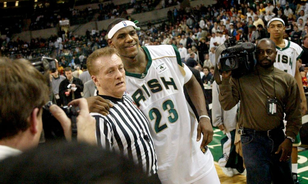 Referee Tony Celantano poses with LeBron James following the Prime Time Shootout in February...