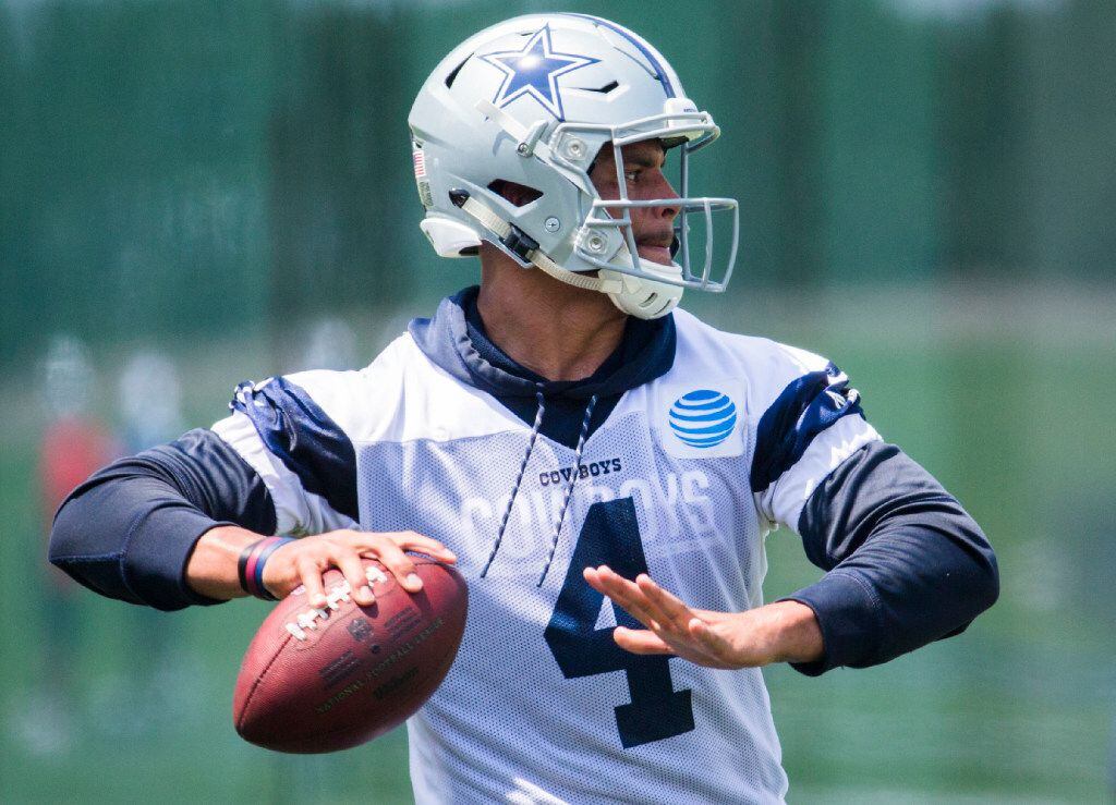 Dallas Cowboys quarterback Dak Prescott (4) throws a pass during practice on Wednesday, June...
