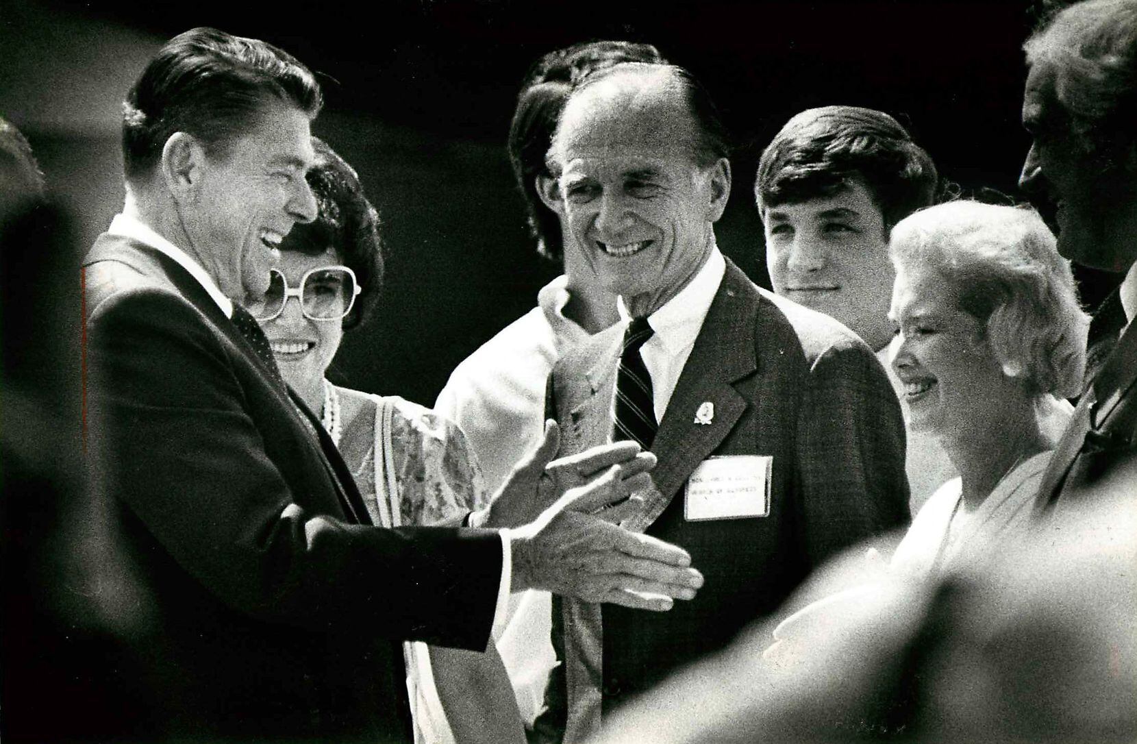 Former President Ronald Reagan was greeted by Rep. Jim Collins (center) and GOP committee...