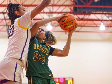 DeSoto’s Dayshauna Crowley (35) is blocked by Montverde Academy Lety Vasconcelos (33) at the...