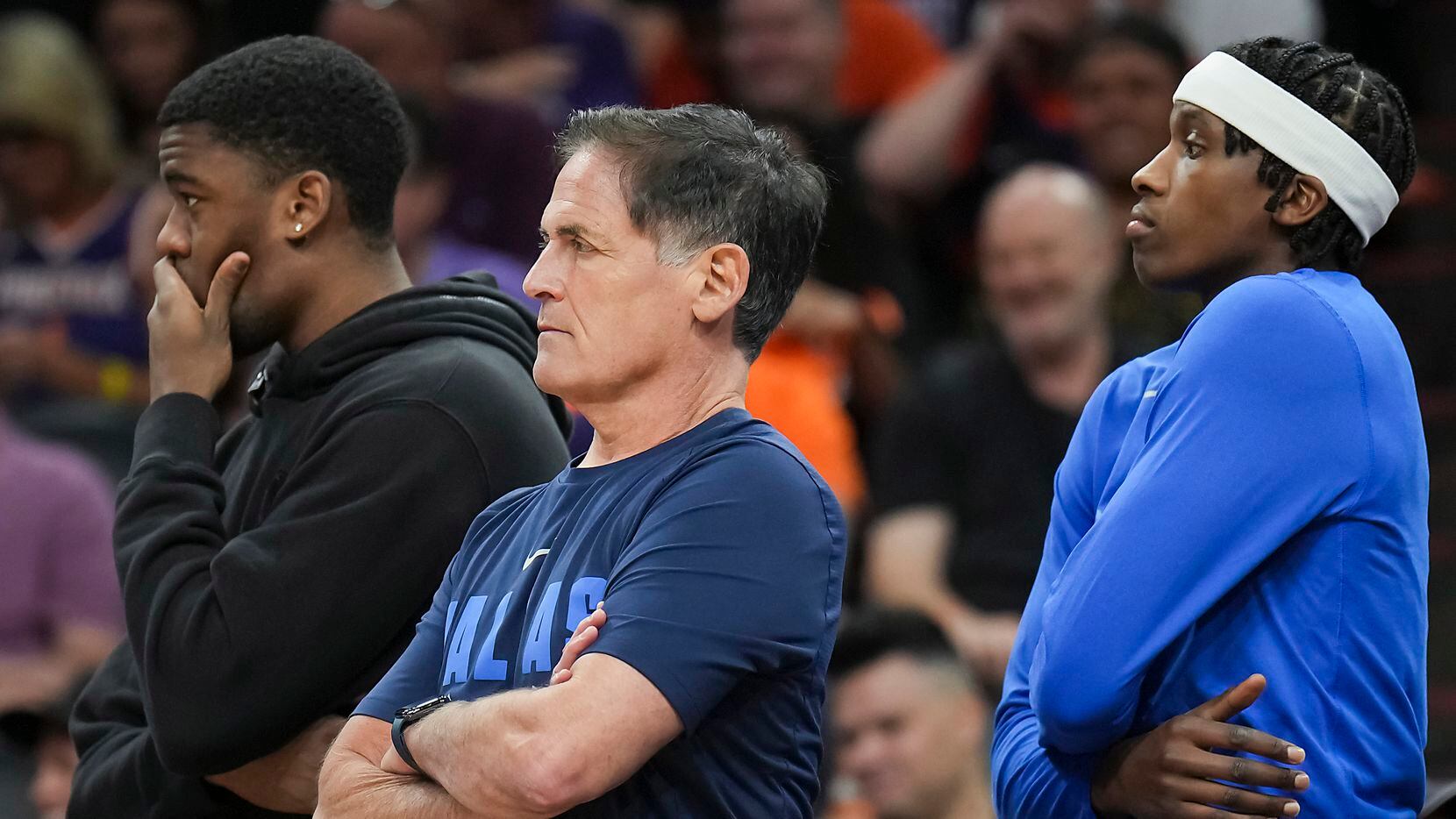 Dallas Mavericks owner Mark Cuban watches from the bench during the second quarter in Game 2...