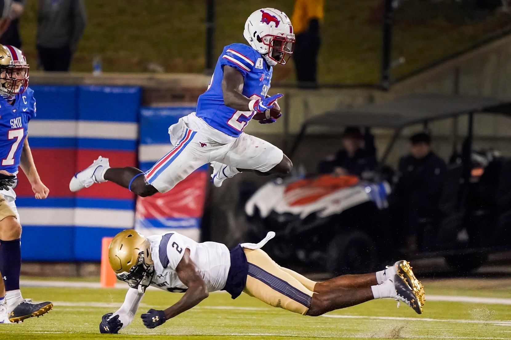 SMU running back Ulysses Bentley IV (26) hurdles Navy cornerback Marcus Wiggins (2) during the third quarter of an NCAA football game at Ford Stadium on Saturday, Oct. 31, 2020, in Dallas. 