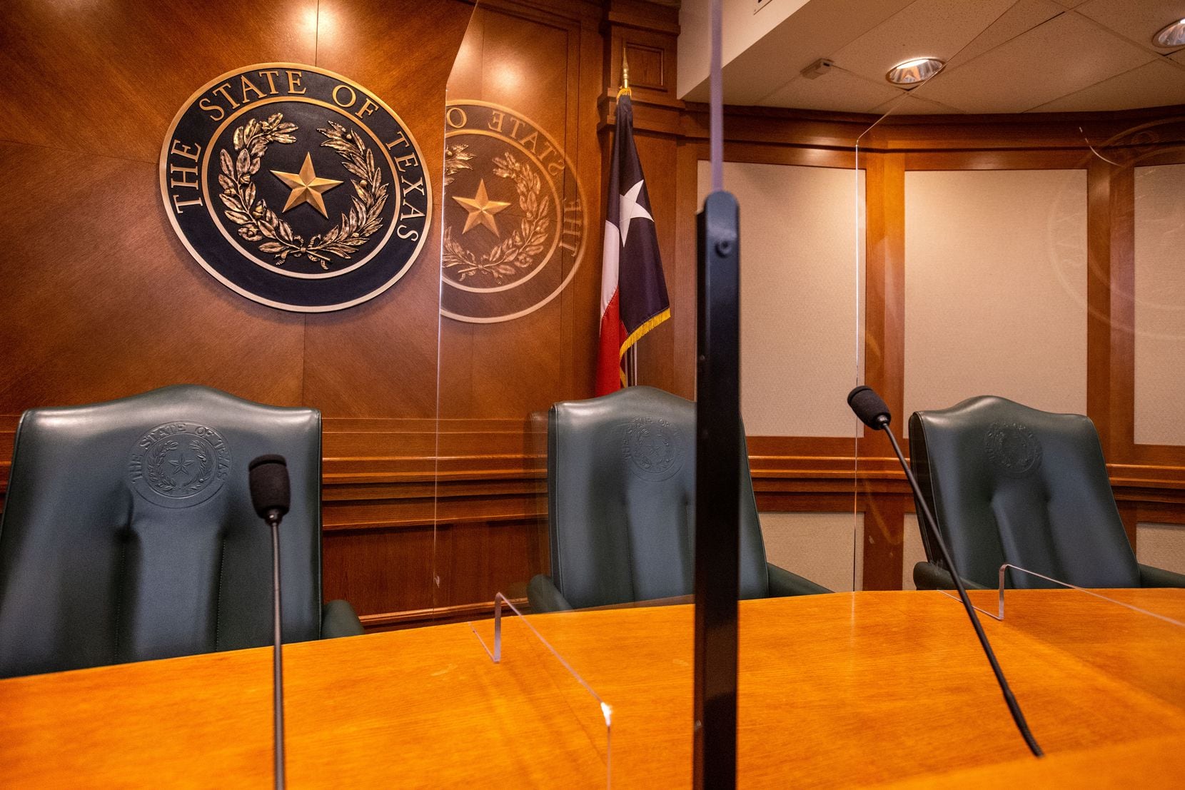 Acrylic glass barriers separate chairs on the dais in a committee room at the Texas Capitol in Austin. Fewer committee hearings are expected to be held than usual, likely reducing the number of bills passed this session.