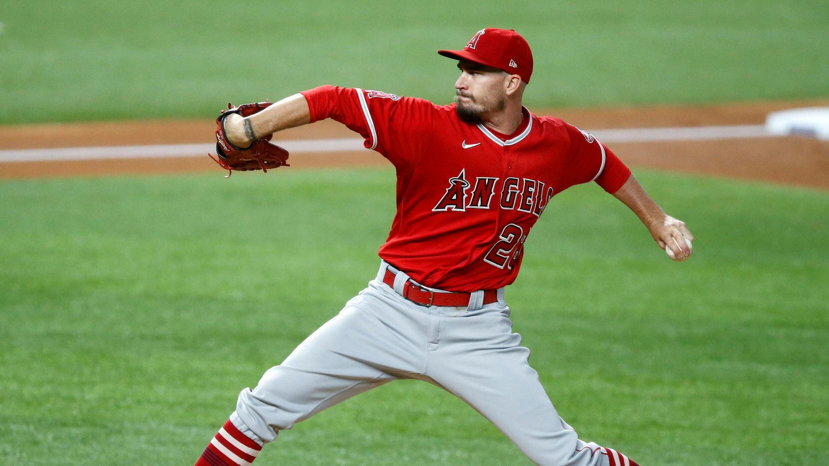 Los Angeles Angels starting pitcher Andrew Heaney (28) throws against the Texas Rangers...