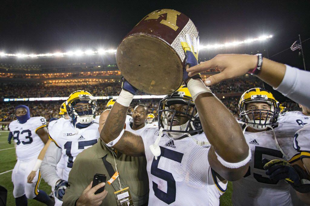 Oct 31, 2015; Minneapolis, MN, USA; Michigan Wolverines safety Jabrill Peppers (5) holds up the brown jug after defeating the Minnesota Golden Gophers at TCF Bank Stadium. Michigan won 29-26. Mandatory Credit: Jesse Johnson-USA TODAY Sports