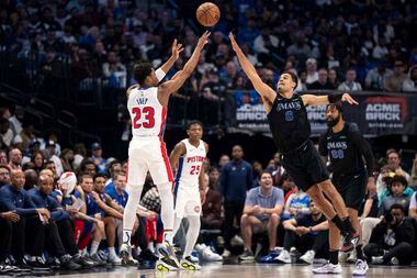 Detroit Pistons guard Jaden Ivey (23) shoots over Dallas Mavericks' Josh Green (8) during...