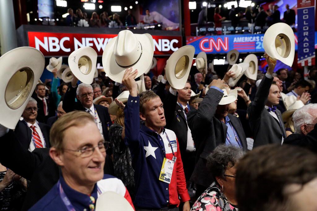 Texas delegates hold up their hats during the final day of the Republican National...