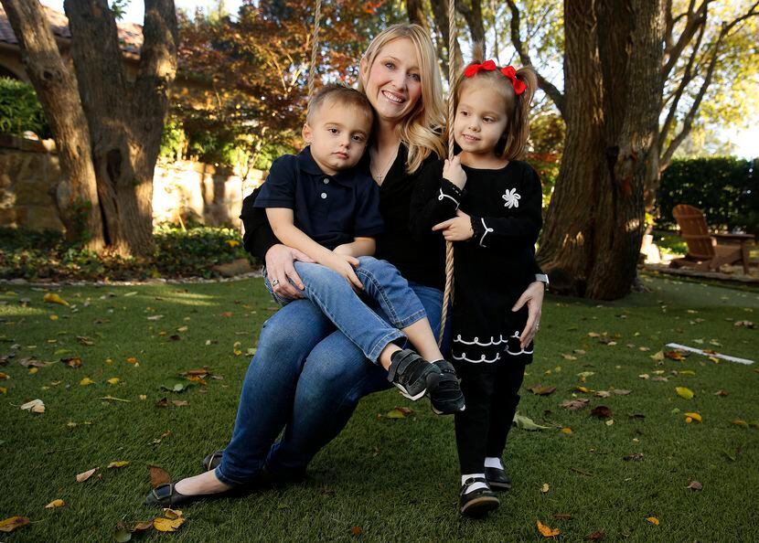 Amber Freed, with her 4-year-old twins, Maxwell and Riley, at their Frisco home.