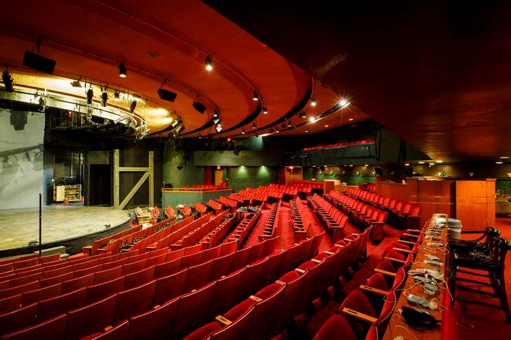 The original gold seating and open theater from 1959 is now bathed in red with the rake...