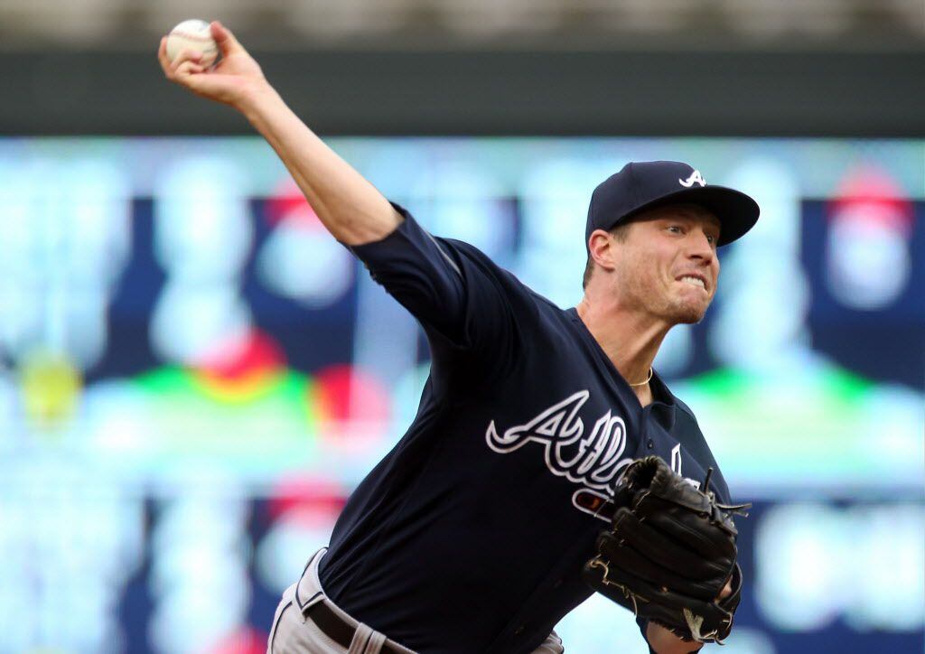 Atlanta Braves pitcher Lucas Harrell throws to a Minnesota Twins batter during the first...