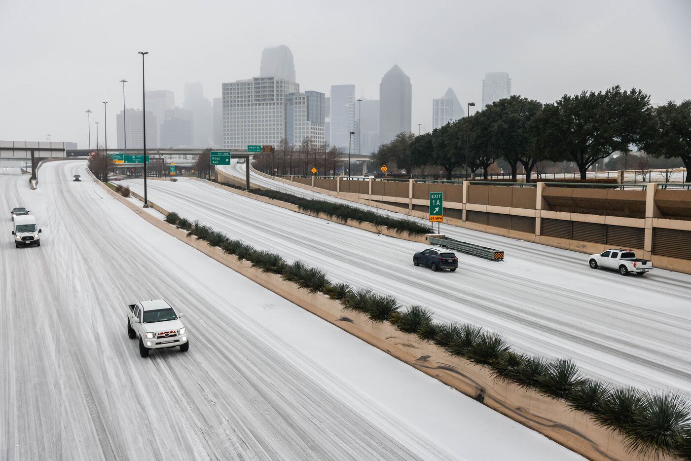 Traffic on US-75 near downtown as sleet falls over the Dallas metroplex on Tuesday, Jan. 31,...