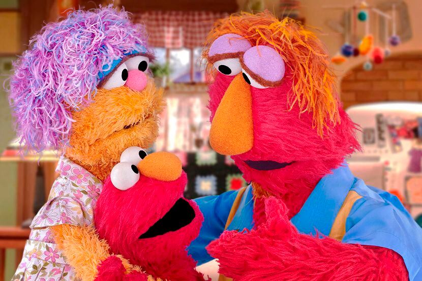 En esta imagen cortesía de Sesame Workshop se ve a Elmo y a sus padres Louie y Mae. (Sesame...