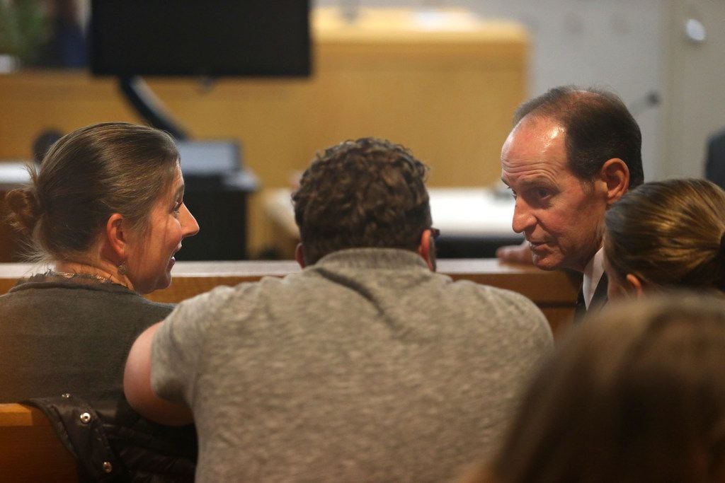 Prosecutor Pat Kirlin (far right) spoke with the parents of Zoe Hastings in court earlier in...
