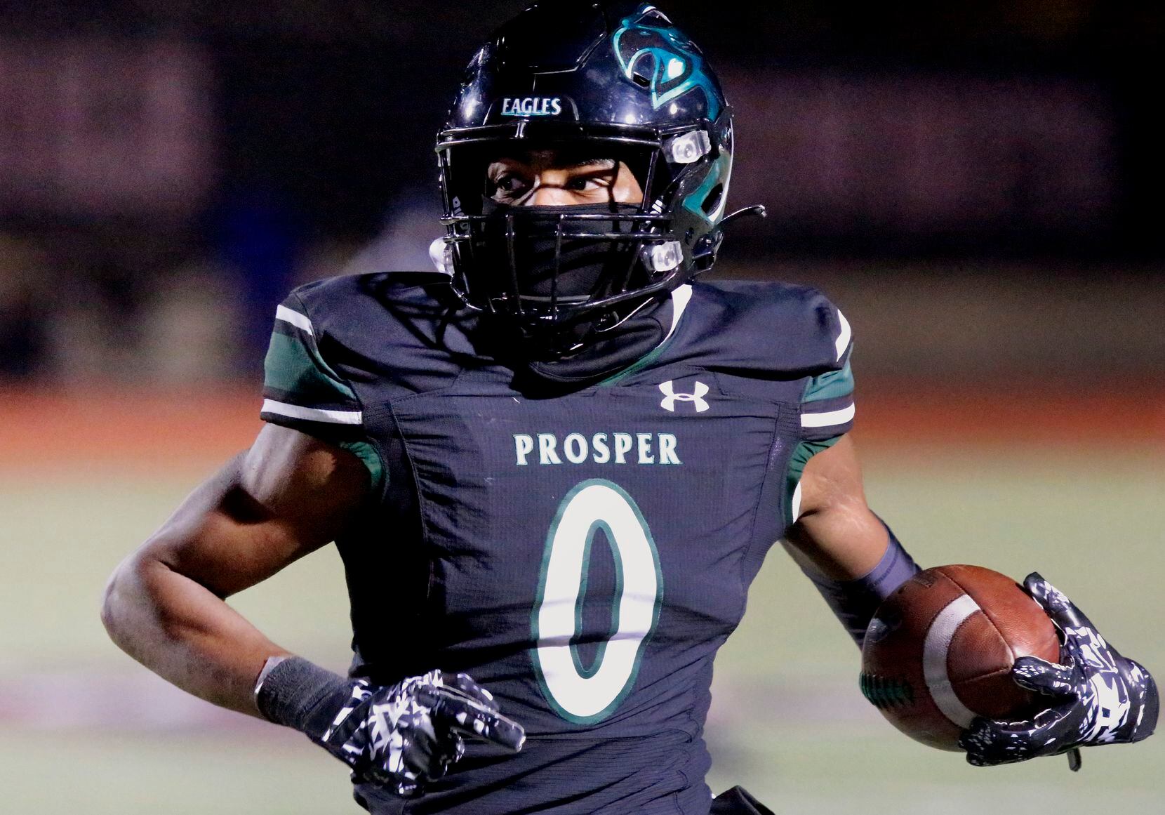 Prosper High School wide receiver Tyler Bailey (0) runs after the catch during the first...